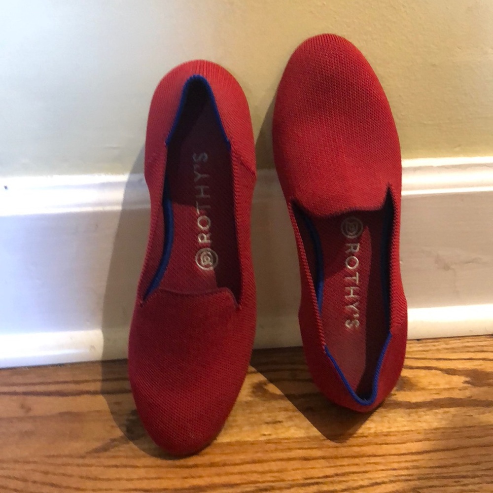 Rothy’s red loafers with blue detail on the ankle.